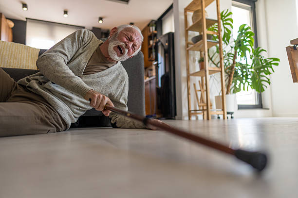 istock Injured Older Man After Fall Reaches Toward Assistive Cane 2215546013