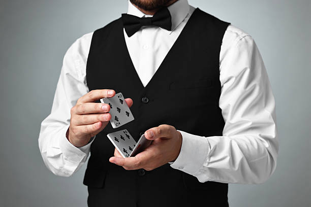 istock Professional croupier shuffling cards on grey background 2215549201