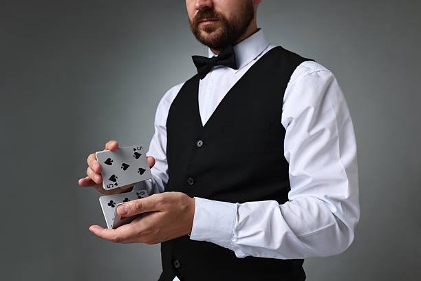 istock Professional croupier shuffling cards on grey background 2215549202