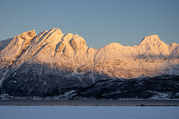 istock Mountains with snow in sunrise, Hamnvik, Norway 2215549687