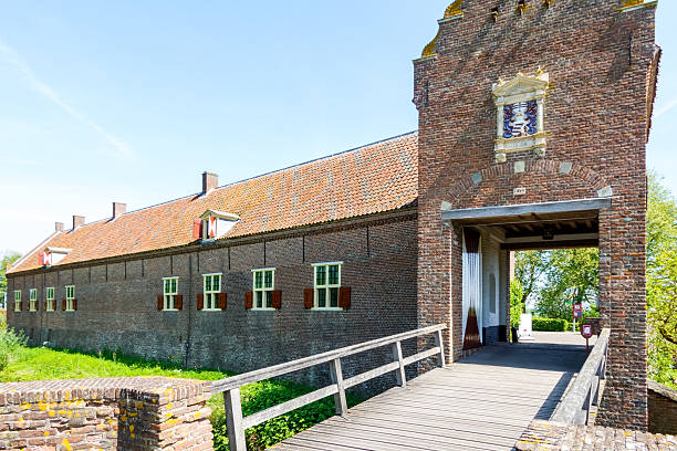 Bridge and gate leading to the outbuildings and garden of Ammersoyen castle near the small town of Ammerzoden in The Netherlands. The castle is a medieval defensive fortress dating back to approx. the year 1350.