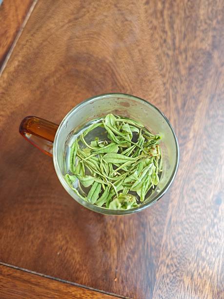 tea in the glass bottle on table