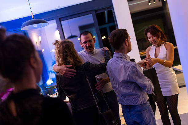 istock Group of People Interacting at a Modern Evening Party 2215551627