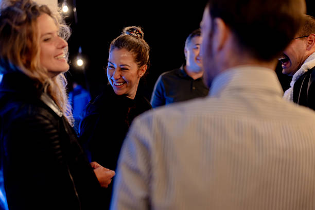 istock A Group of Friends Smiling and Enjoying a Cheerful Conversation in a Relaxed Environment 2215551663