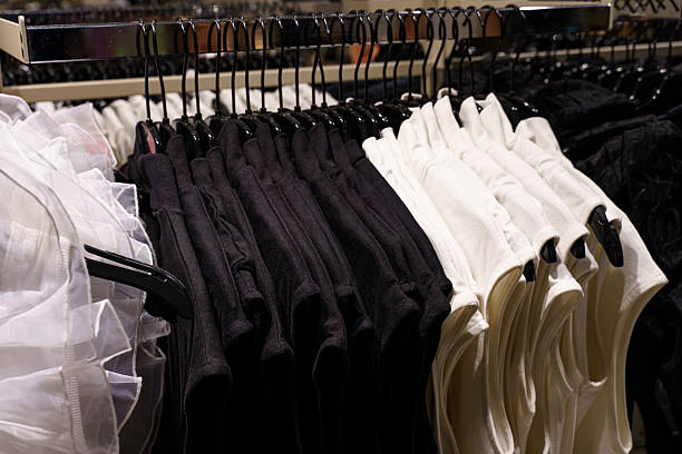 istock Discovering a stylish array of classic black and white clothing in a boutique 2215552058