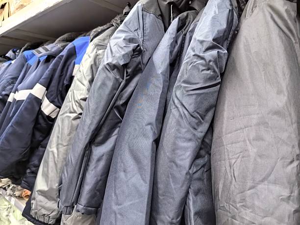 istock Variety of jackets displayed on a rack in a bustling market setting 2215552062
