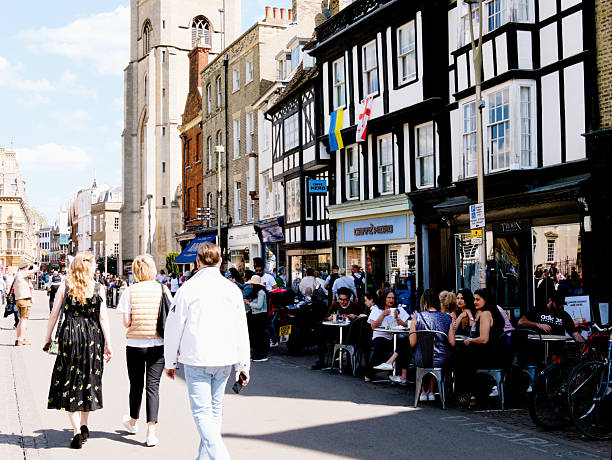 Cambridge, Cambridgeshire / United Kingdom - May 11th 2025: People sitting eating and drinking at Fitzbillies on King's Parade