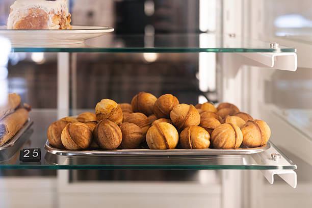 istock Walnut shaped cookies with boiled condensed milk in the bakery window. 2215559567