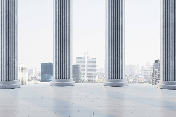 istock Classical stone columns with cityscape background and soft light on tiled floor, creating a creative architectural contrast scene. 3D Rendering 2215568474