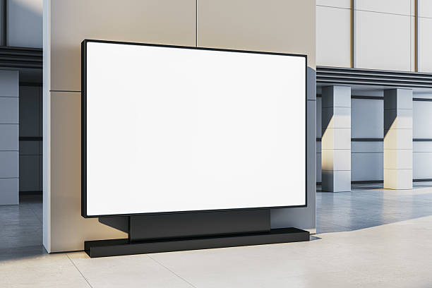 istock Blank billboard mockup with clean white screen in modern indoor setting for advertising or branding template concept display. 3D Rendering 2215568475