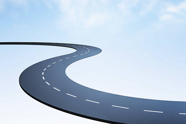 istock Curved road with dashed lane markings floating in mid-air against a bright sky background, symbolizing way, direction and futuristic path design. 3D Rendering 2215568482