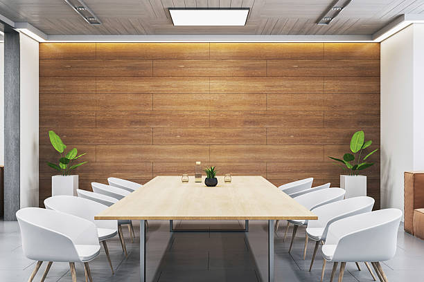 istock Modern empty conference room with minimalist interior, wooden wall accent, white chairs, and light wood table in corporate office space. 3D Rendering 2215568509