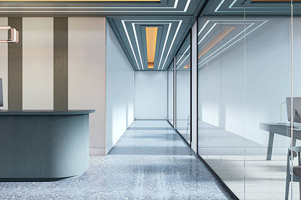 istock Modern corporate office hallway with glass partitions, ambient lighting, and reception counter in sleek architectural interior design concept. 3D Rendering 2215568709