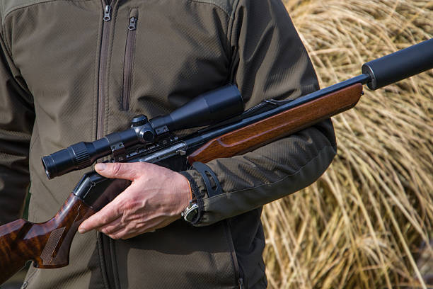 a man with a rifle in his hand