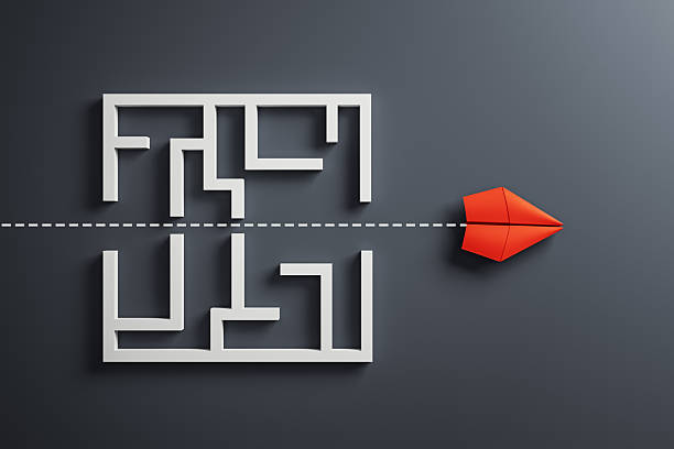 istock Red paper plane flying straight through maze with dotted path on dark background, symbolizing leadership and innovative direction concept. 3D Rendering 2215569131