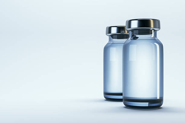istock Two clean transparent medical vials with metallic caps standing side by side on a light gradient background, ideal for branding or mockup template use. 3D Rendering 2215569325
