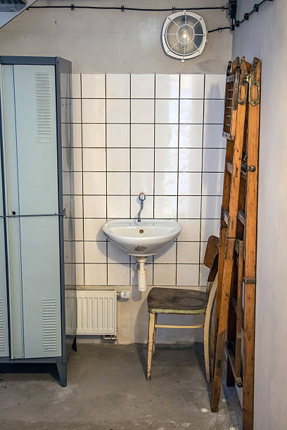 istock A retro cloakroom with wash basin in the old workshop. A dressing-room for workers, typical architectural style of socialist epoche, Czech republic. 2215570120