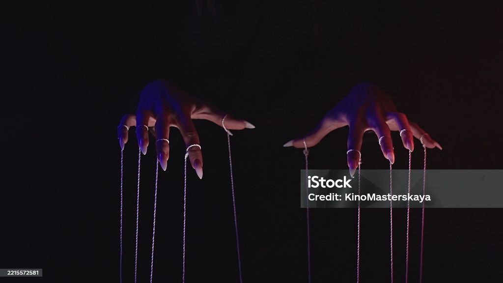 String Puppet Attacking Hands Manipulating Puppet Strings In Dramatic Lighting Stock Photo ...