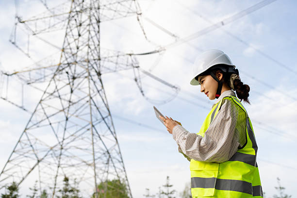 istock Asian female power technician working at power station 2215573812