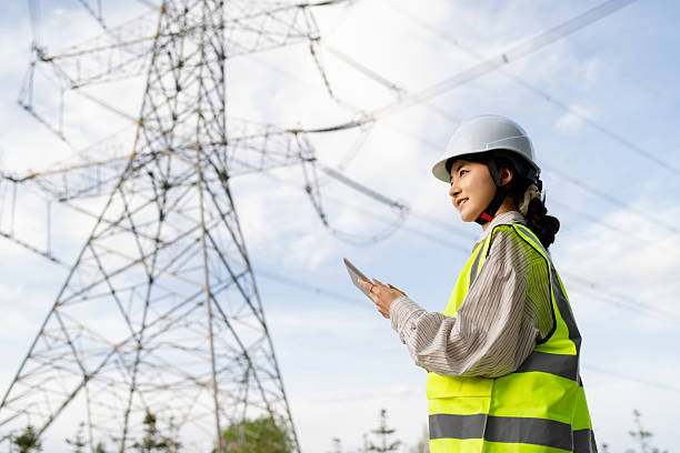 istock Asian female power technician working at power station 2215573829