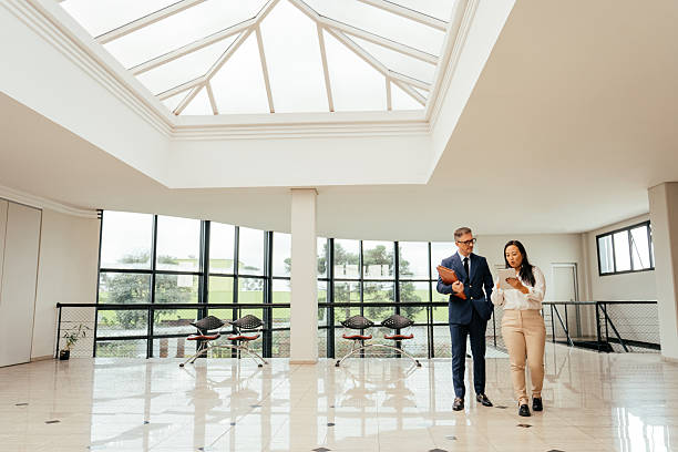 istock Entrepreneurs talking in a large, modern room 2215576422