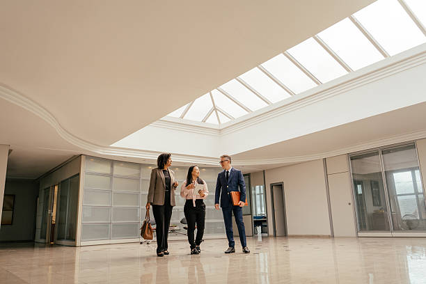 istock Entrepreneurs talking in a large, modern room 2215576449