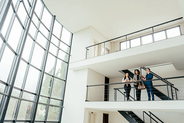 istock Entrepreneurs talking in a large, modern room 2215576494