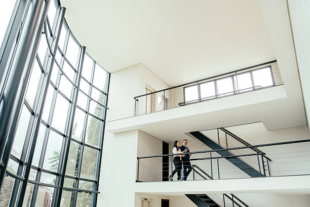 istock Entrepreneurs talking in a large, modern room 2215576500