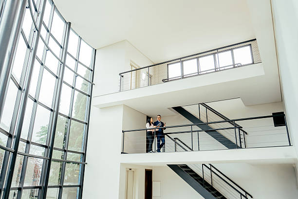 istock Entrepreneurs talking in a large, modern room 2215576503