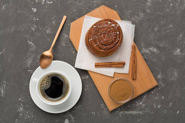 istock Sweet homemade cinnamon rolls on concrete background, top view 2215579922