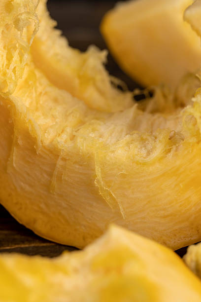 istock orange pumpkin fruit details cut into pieces for cooking 2215585516