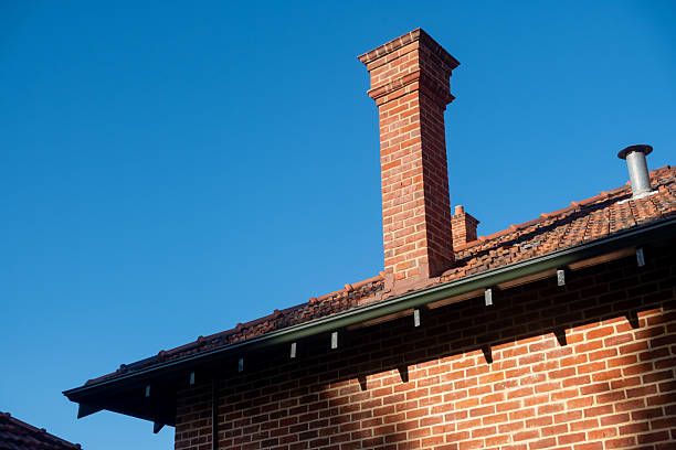 istock An old brick building with a chimney, vintage industrial architecture 2215587429