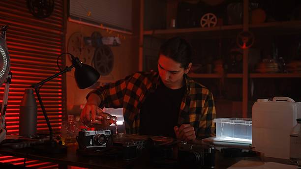 Analog Photography Darkroom Process with Red Lighting Ambiance