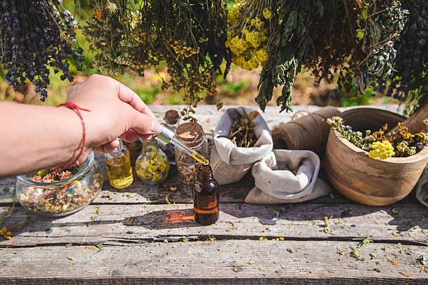 istock Dried herbs medicinal tinctures extracts in the garden. Selective focus. 2215594031