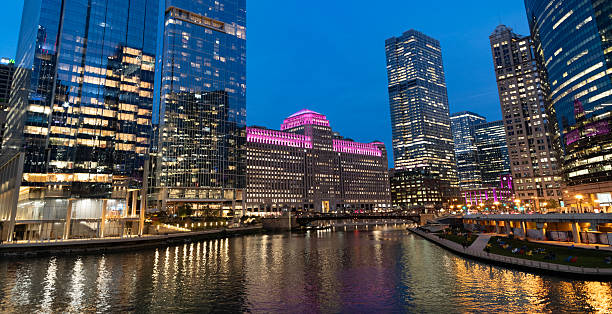 istock Chicago architecture of skyscraper at river. City night illuminated building. Skyscraper cityscape. Night city of Chicago, Illinois. Business city. Night cityscape of Chicago skyscraper building 2215596456