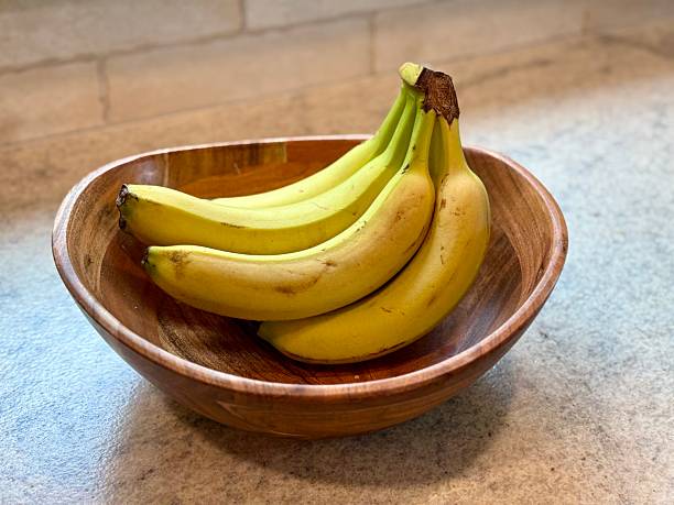 istock Banana in wooden Bowl 2215597721