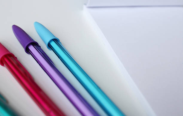 istock Set of cool color ballpoint pen and blank paper notebook. 2215601461