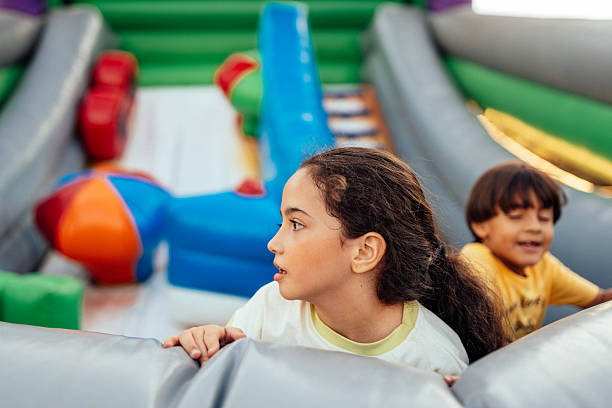Children in inflatable amusement park