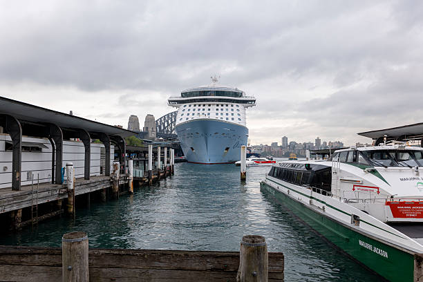 Sydney, Australia: March 24th, 2025. Harbour Bridge, ferry and cruise ship in Sydney Harbour, Australia
