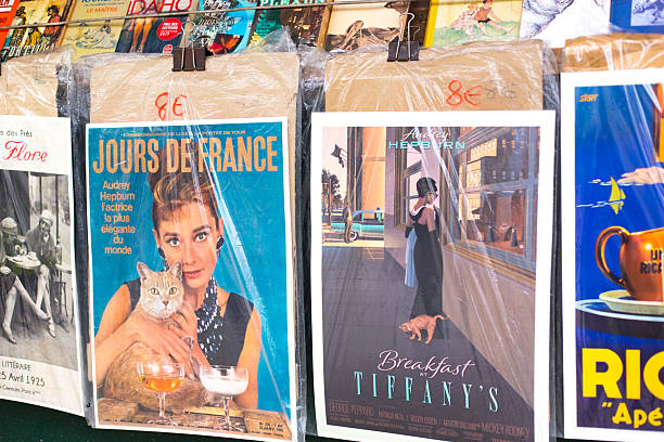 Paris, France: Vintage Audrey Hepburn posters hang at an outdoor antiquarian bookseller (bouquiniste) on the banks of the Seine.