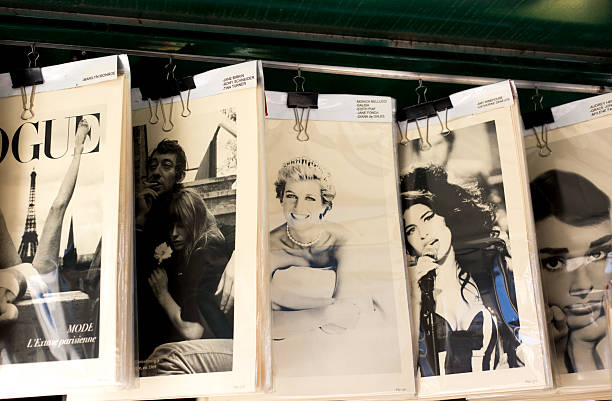 Paris, France: A retail display of vintage posters at an outdoor antiquarian bookseller (bouquiniste) on the (off-camera) banks of the Seine. The posters show the following celebrities: Serge Gainsbourg, Princess Diana, Amy Winehouse, and Audrey Hepburn.