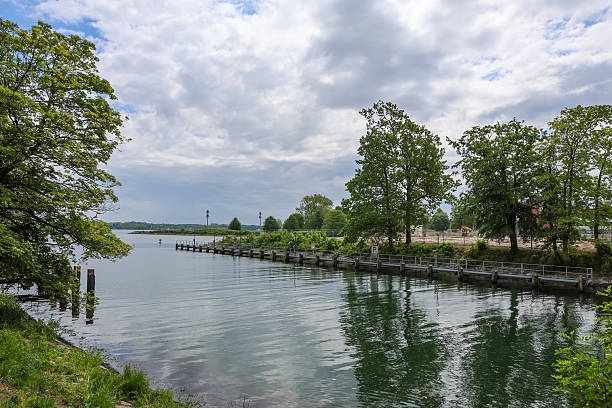 istock Calm canal ending in Lake Constance on a cloudy day 2215629001