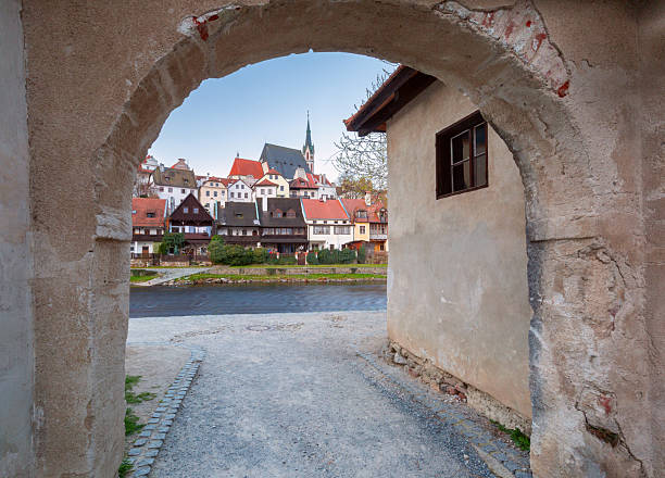 Historic townscape of Cesky Krumlov viewed through stone archway in Cesky Krumlov, Czech Republic