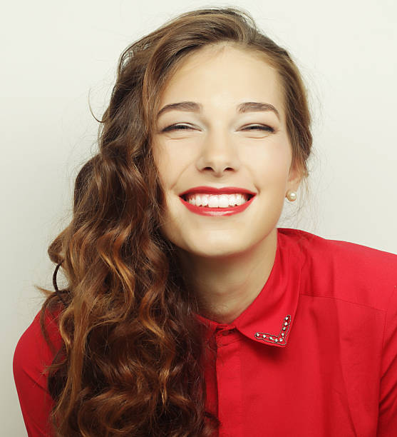 Beautiful young surprised woman. Studio shot.