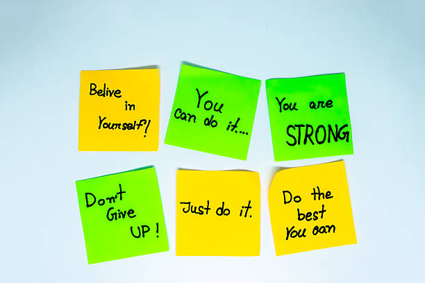 istock Handwritten motivational lines on sticky notes isolated on white background 2215638594