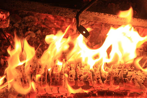 Cj Plays an old broken piano with the keys on fire, and then poses on it as it burns.