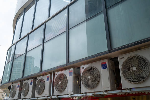 A row of household HVAC outdoor units