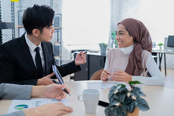 istock Asian young architects discuss project using digital tablet in the office stock photo 2215646201