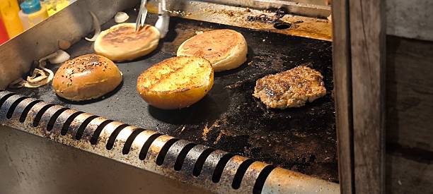 istock Hamburger is a fast food. Hamburger from a street stall. 2215651599
