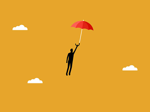 istock Businessman flying freely with umbrella in hand 2215651624